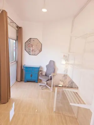 a room with a desk and a chair and a table at Crane nest 9 palm tree villa view in Bangkok