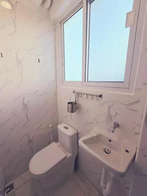 a white bathroom with a toilet and a sink at Crane nest 9 palm tree villa view in Bangkok