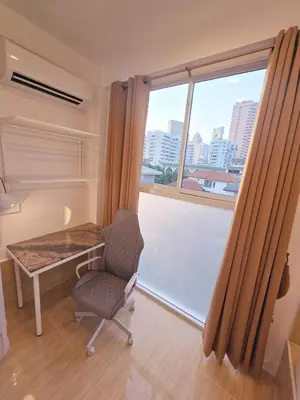 a room with a desk and a chair and a window at Crane nest 13 Bangkok downtown view in Bangkok