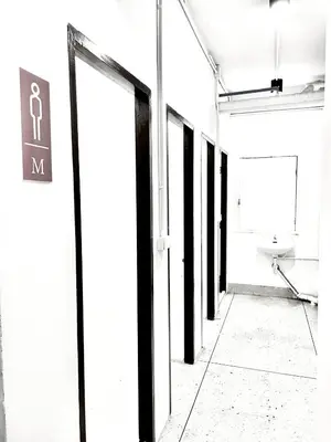 an empty hallway with a toilet in a building at XX Mitr inn Khaosan มิตร อินน์ ถนนข้าวสาร 2 in Bangkok