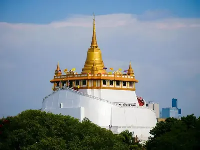 a building with a gold top on top of it at XX Mitr inn Khaosan มิตร อินน์ ถนนข้าวสาร 2 in Bangkok