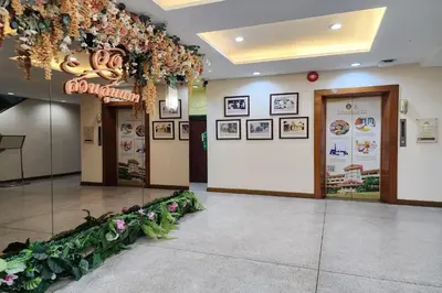 a lobby with a bunch of flowers on the wall at Suan Sunandha Palace Hotel in Bangkok