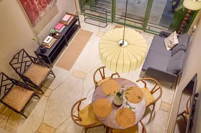 an overhead view of a table and chairs with umbrellas at Newly Renovated, 4BR Townhouse , 5min MRT , Group in Bangkok