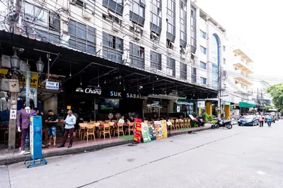 a group of people standing outside of a restaurant at XX The Hidden khaosen เดอะ ฮิดเด้น ตรอกข้าวสาร in Bangkok