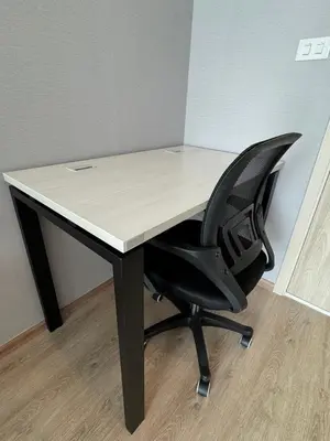 a desk with a black chair and a white table at Luxury 1 BR Bangkok New CBD High Fl MRT Rama 9 in Bangkok