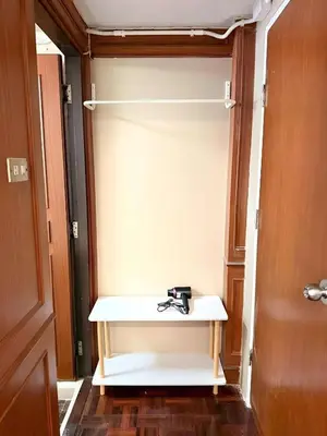 a closet with a white bench in a room at XX Stay On Sukhumvit 11 - สเตย์ออน สุขุมวิท ซอย 11 in Bangkok