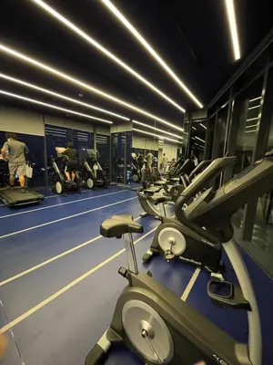 a gym with a row of treadmills and machines at Fully equipped Ideo Rama9-Asoke, with workstation in Bangkok