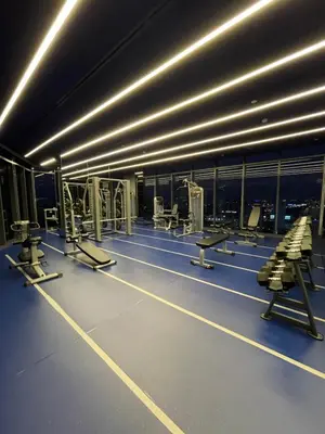 a gym with rows of chairs and tables and lights at Fully equipped Ideo Rama9-Asoke, with workstation in Bangkok