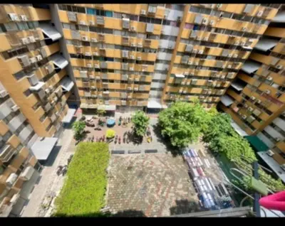 an aerial view of a large building with trees and buildings at แม่น้องรับตังค์ in Thung Si Kan