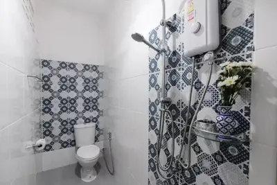 a bathroom with a toilet and a shower at Whole House - 4Bedrooms - Experience Local Life in Bangkok