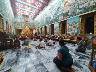 a group of people sitting in a room with paintings on the walls at Whole House - 4Bedrooms - Experience Local Life in Bangkok