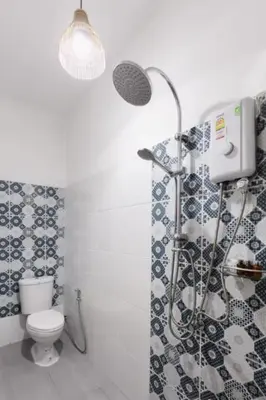 a bathroom with a shower and a toilet at Whole House - 4Bedrooms - Experience Local Life in Bangkok