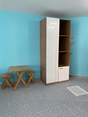 a room with a table and a cabinet at Muangthongthani Rental/Khun Dan in Nonthaburi