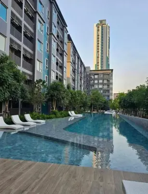 a large swimming pool in a city with buildings at High Floor Luxury Studio with Great Views in Sathani Ban Hua Mak