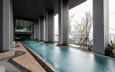 a swimming pool in the middle of a building at High Floor Luxury Studio with Great Views in Sathani Ban Hua Mak