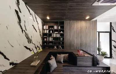 a living room with a couch and a book shelf at High Floor Luxury Studio with Great Views in Sathani Ban Hua Mak