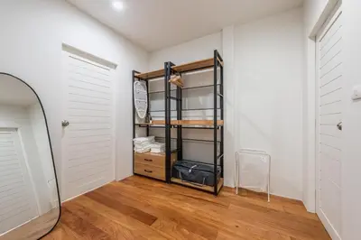 a dressing room with a mirror and a closet at The Urban478 Modern&Cozy Stay in Bangkok