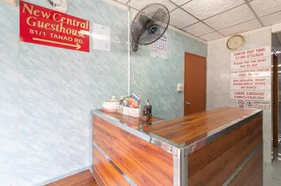 a bar in a restaurant with a sign on the wall at New Central Guesthouse in Bangkok