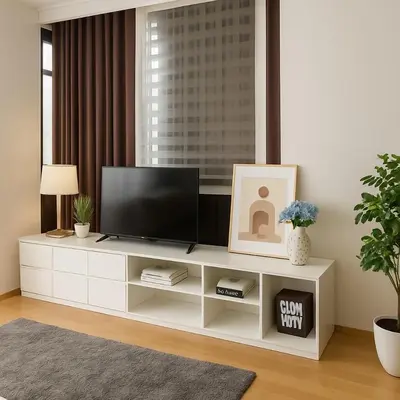 a living room with a television on a white entertainment center at Spacious 2 King Beds, Balcony with View, Near Nana BTS in Bangkok