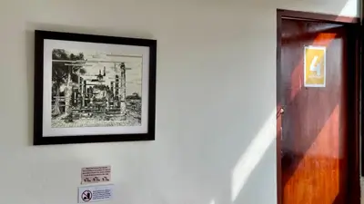 a picture on a wall with a picture on it at Baan PadSeeEw - Rooftop Riverview 4th floor in Thonhuri