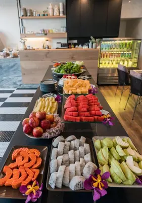 a table with many different types of food on it at The Residence on Thonglor by UHG in Bangkok