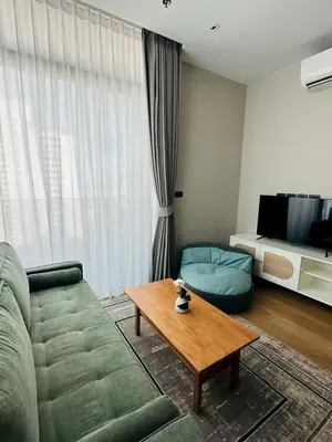 a living room with a couch and a coffee table at The Fine 2-bedroom in Bangkok
