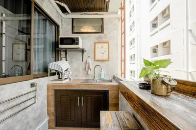 a kitchen with a sink and a counter top at Double Studio with Balcony & Private Bath by Smile Loft in Bangkok
