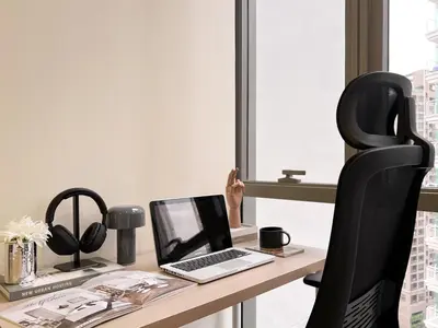 an office with a desk with a laptop and a chair at Modern elegance 2B Ultra Fast WiFi BTS Phrakhanong in Bangkok