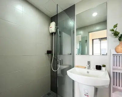 a bathroom with a sink and a shower at Cozy Park-view 1BR - Ultra Fast Wifi - BTS Bangna in Bangkok