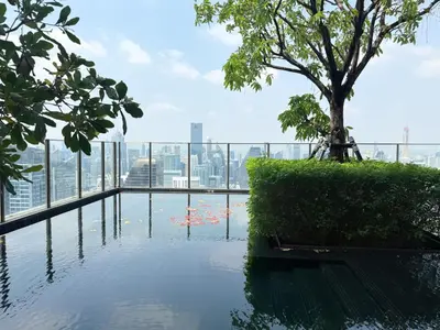 a pool of water with a tree on top of a building at Luxurious Downtown 1BR - Ultra Fast WiFi - BTS Asoke in Bangkok