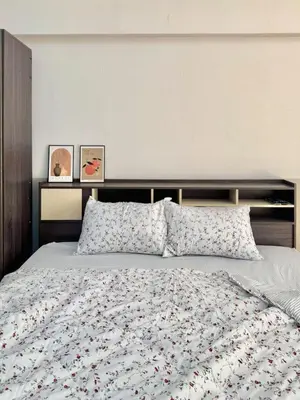 a bedroom with a large bed with flowers on it at Budget 1b1b Heart of Ramkamheng in Sathani Khlong Tan