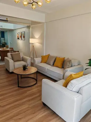 a living room with two couches and a table at Super cozy new townhome in central of Bangkok 4 PAX in Ban Chek
