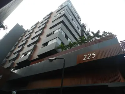 a large building with the number on it at Nanatai Suites in Bangkok