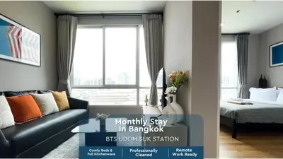 a room with a couch and a bed and a window at Prime Sukhumvit Stay 1 BR - Fast WiFi - BTS Udomsuk in Bangkok