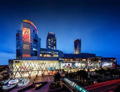 a large building with a train station at night at XX Wish Inn Chidlom Bangkok - วิชอินน์ ชิดลม กรุงเทพ in Pratunam