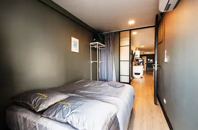 a bedroom with a large bed in a room at 2 bedroom state tower Sathorn in Bangkok