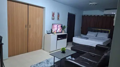 a living room with a bed and a couch at Popular Muang Thong Condo, Building C5 in Ban Bang Phang