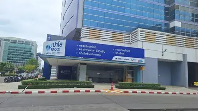 a building with a sign in front of it at Popular Muang Thong Condo, Building C5 in Ban Bang Phang