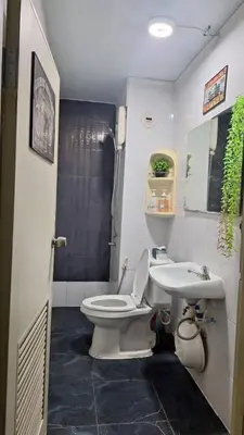 a bathroom with a toilet and a sink at Popular Muang Thong Condo, Building C5 in Ban Bang Phang