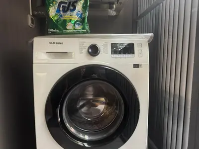a white washer and dryer in a room at BTS Thong Lor Downtown Low-rise Large Studio #Private Courtyard Super Large Pool in Bangkok