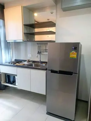 a kitchen with a stainless steel refrigerator and a sink at Immaculate Quite Resort Home, brand new ACsWiFi in Amphoe Phra Khanong