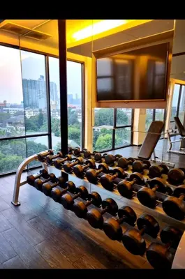 a large room with a bunch of chairs in a building at Immaculate Quite Resort Home, brand new ACsWiFi in Amphoe Phra Khanong