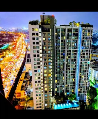 a view of a city at night with tall buildings at Immaculate Quite Resort Home, brand new ACsWiFi in Amphoe Phra Khanong