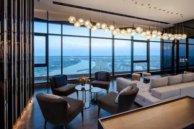 a living room with a couch and chairs at Luxury Riverside condo in Nonthaburi