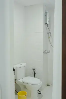 a white bathroom with a toilet and a shower at Big unit for 8 people, city center Silom in Bangkok