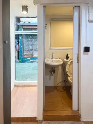a bathroom with a sink and a toilet at Chubbi 5 Room1 in Ban Bang Bamru