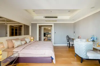 a bedroom with a bed and a desk and a chair at High-Floor City View Near SIAM in Bangkok