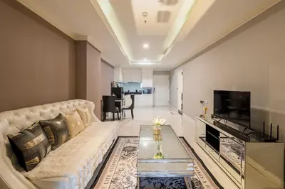 a living room with a couch and a tv at High-Floor City View Near SIAM in Bangkok