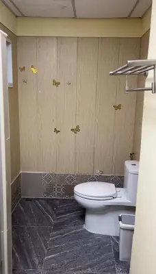 a bathroom with a toilet and a sink at UOKResort in Ban Khlong Yuan