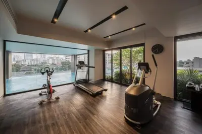 a gym with two exercise bikes and a treadmill at Bangkok Tryp in Bangkok